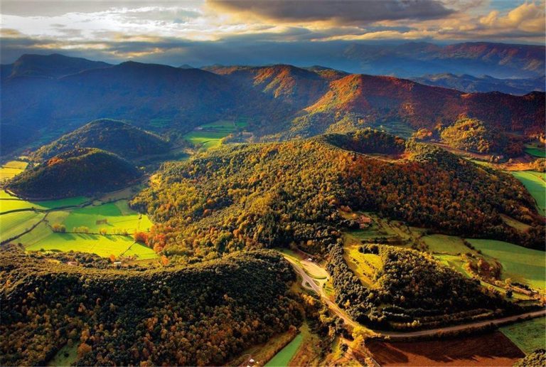 Aerial view of the volcanoes and forests of La Garrotxa in autumn colours